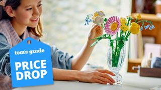 Person building a Lego Petite Sunny Bouquet set