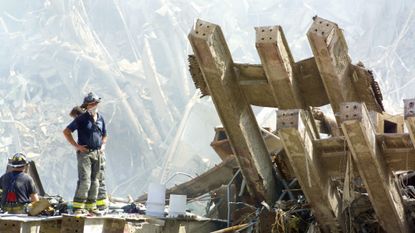 Rescue workers stand amid the rubble of the World Trade Center following the Sept. 11, 2001, terrorist attacks.