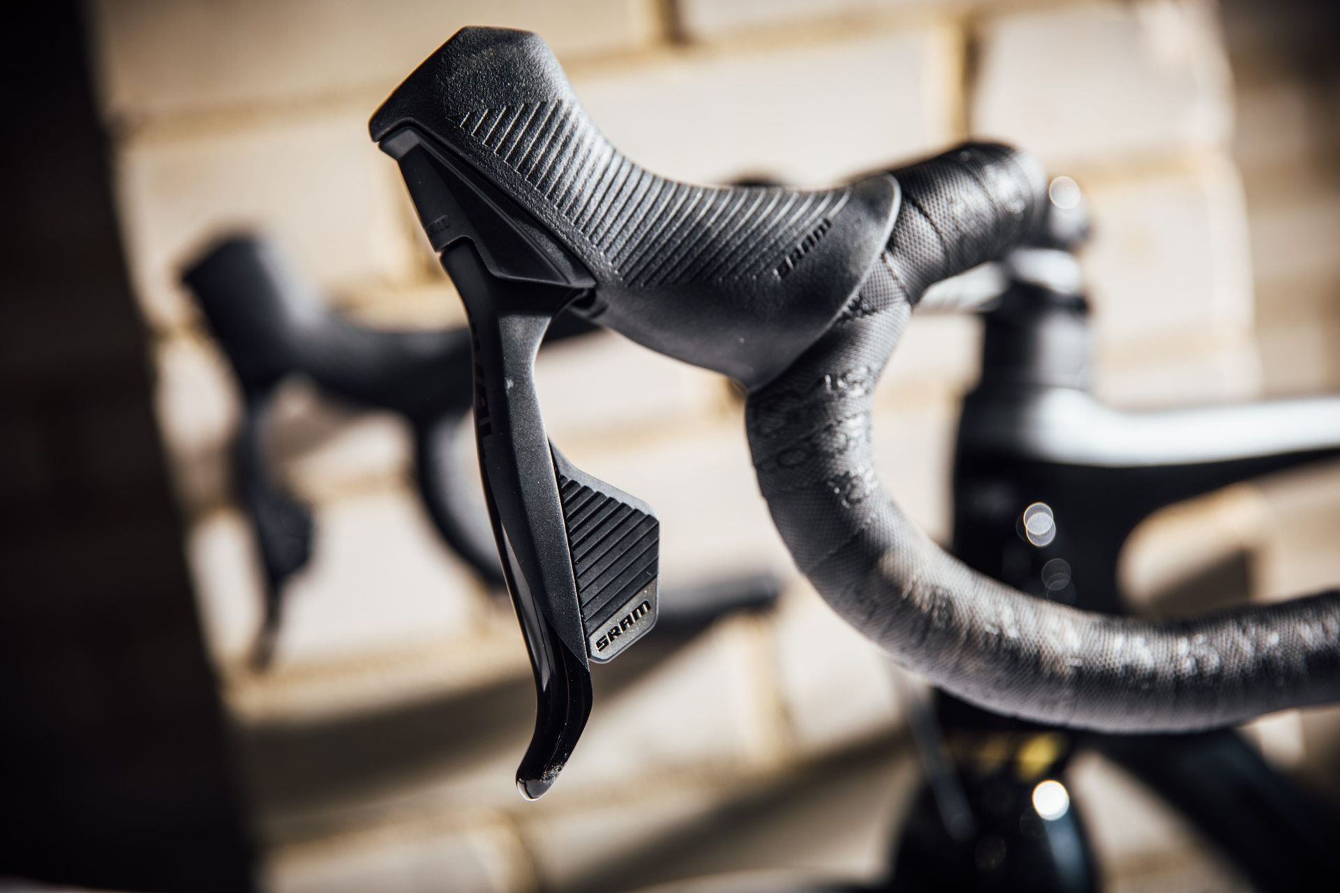 SRAM Rival eTap AXS shifter for changing gears on a bike