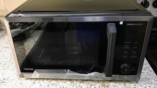 Toshiba ‎ML2-TC10SAIT 1.1 Cu. Ft. Compact Microwave being tested in writer's home