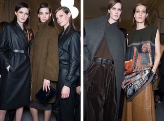 Female models pose together in dark winter clothing