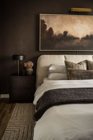 Dark brown bedroom with light bed
