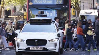 A Waymo self-driving taxi on a training run in London