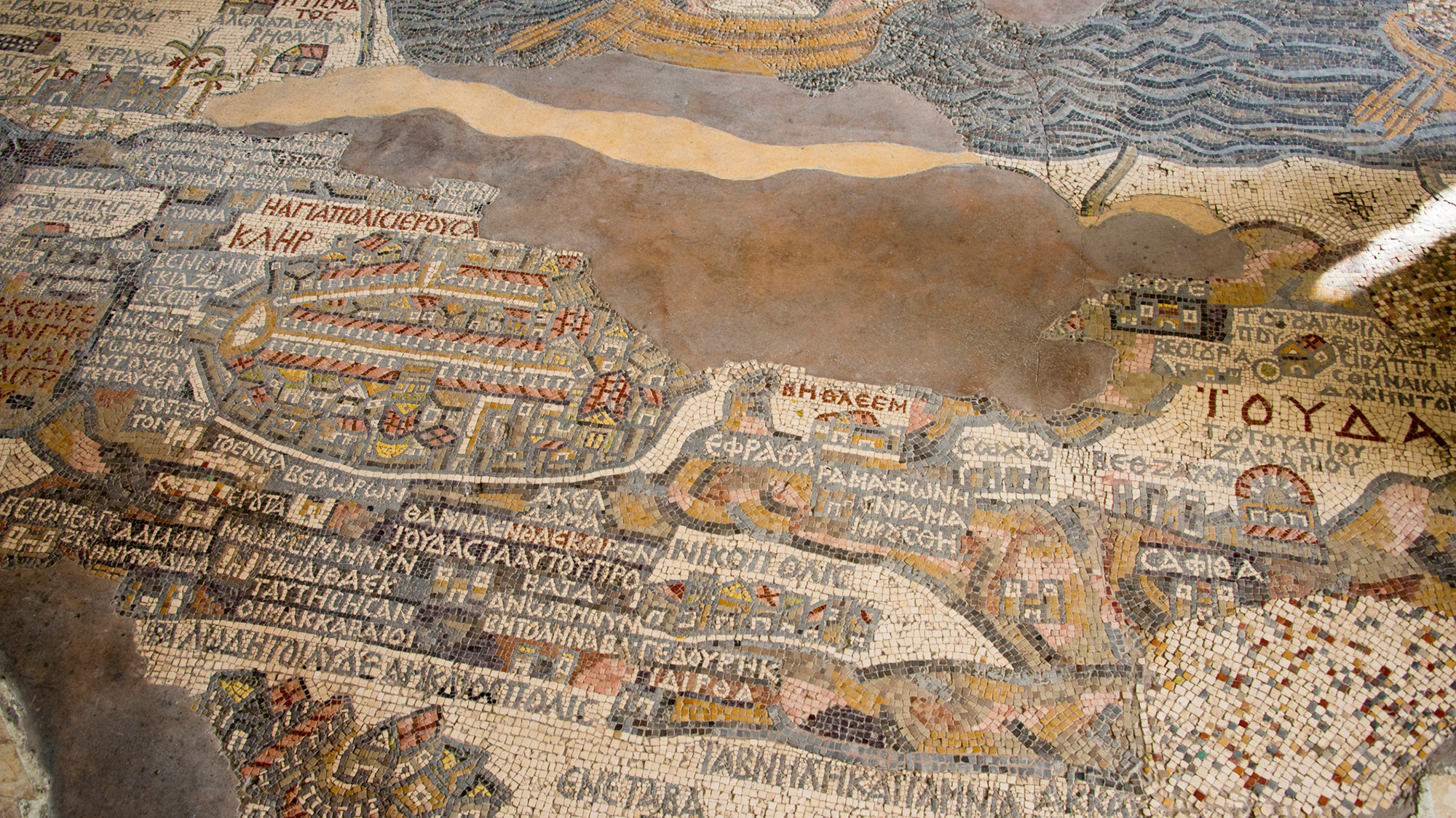 A centuries-old mosaic showing a map of of the holy land.