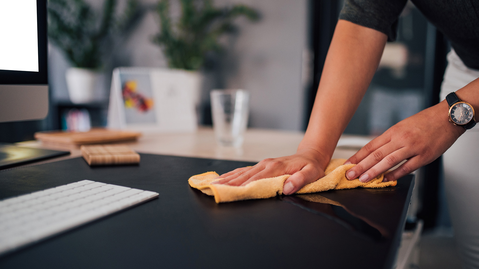 Woman cleaning desk