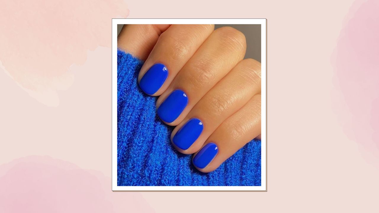 Short square nails painted with bright cobalt blue polish