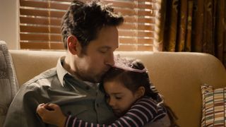 Scott Lang kisses his daughter Cassie on the head in Ant-Man