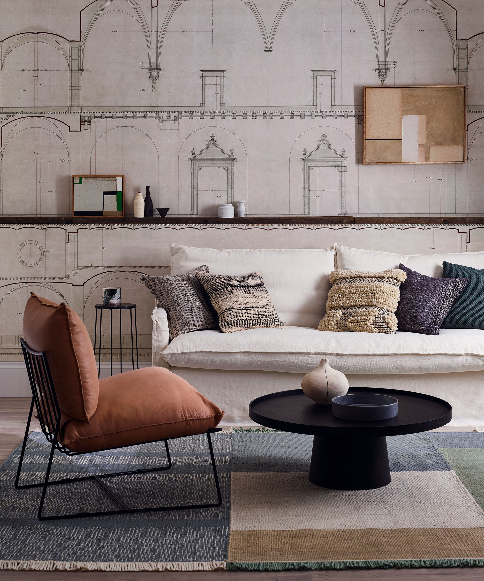 Living room ideas featuring an architectural mural and a scheme with neutral, muted furnishings