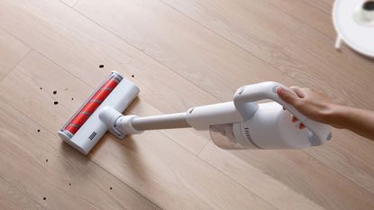 A white cordless vacuum cleaner