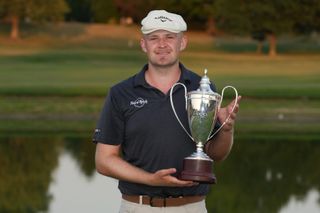 Harry Hall holds the ISCO Championship trophy