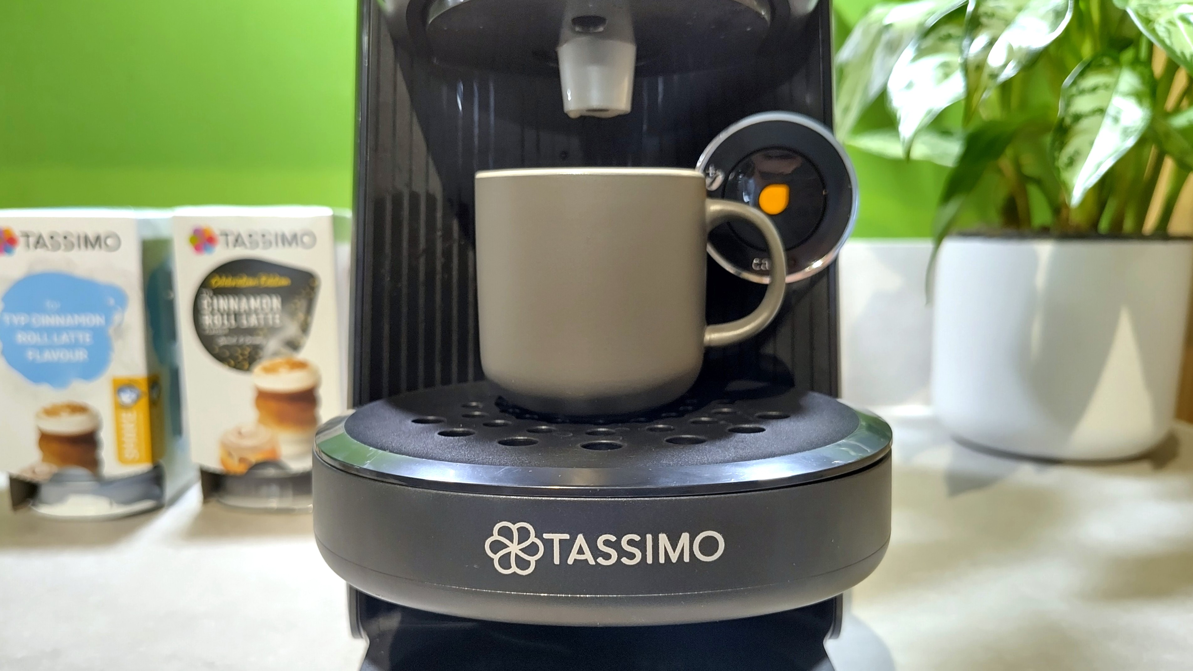 Bosch Tassimo Finesse Friendly coffee maker with drip tray raised ready to dispense espresso