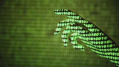 A hand with green binary projected onto it