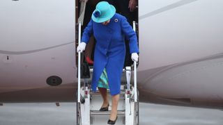 Queen Elizabeth II walks down the stairs of her plane upon her arrival with Prince Philip, the Duke of Edinburgh, at Tegel airport on the first of their four-day visit to Germany on June 23, 2015 in Berlin, Germany.