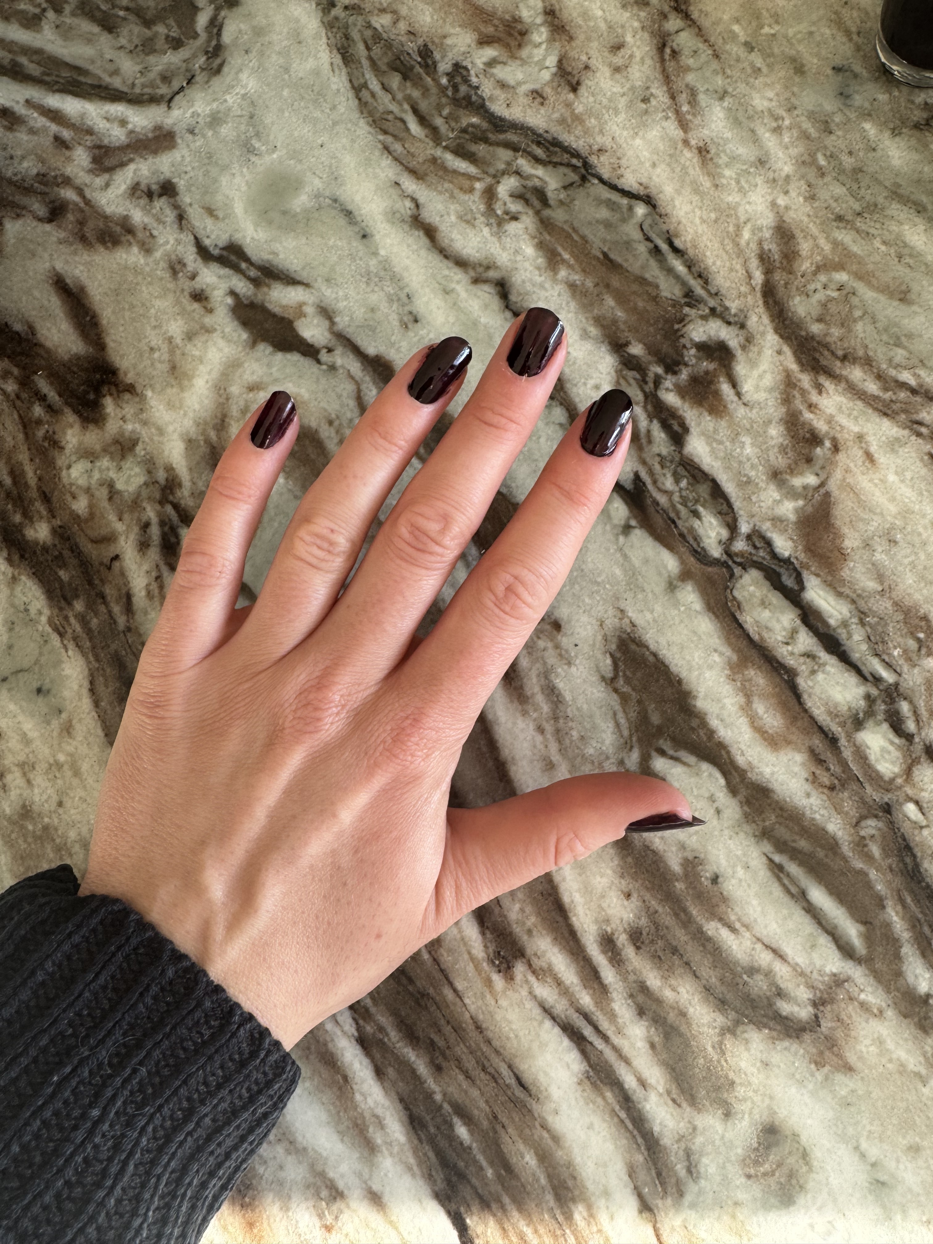 Eleanor wearing OPI Lincoln Park After Dark nail polish on her nails