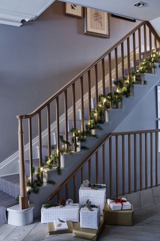 elegant Christmas stair decor garland and lights by Sims Hilditch