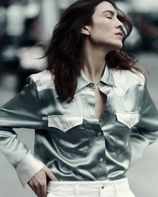 Alexa Chung wearing a button down shirt from her Madewell collaboration