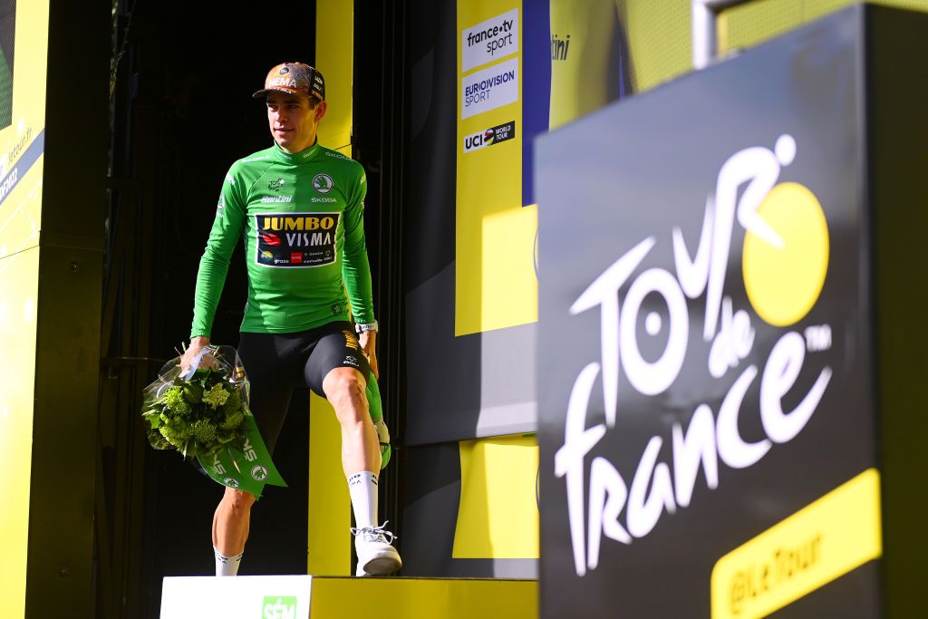 SAINTETIENNE FRANCE JULY 15 Wout Van Aert of Belgium and Team Jumbo Visma Green Points Jersey celebrates at podium during the 109th Tour de France 2022 Stage 13 a 1926km stage from Le Bourg dOisans to SaintEtienne 488m TDF2022 WorldTour on July 15 2022 in SaintEtienne France Photo by Tim de WaeleGetty Images