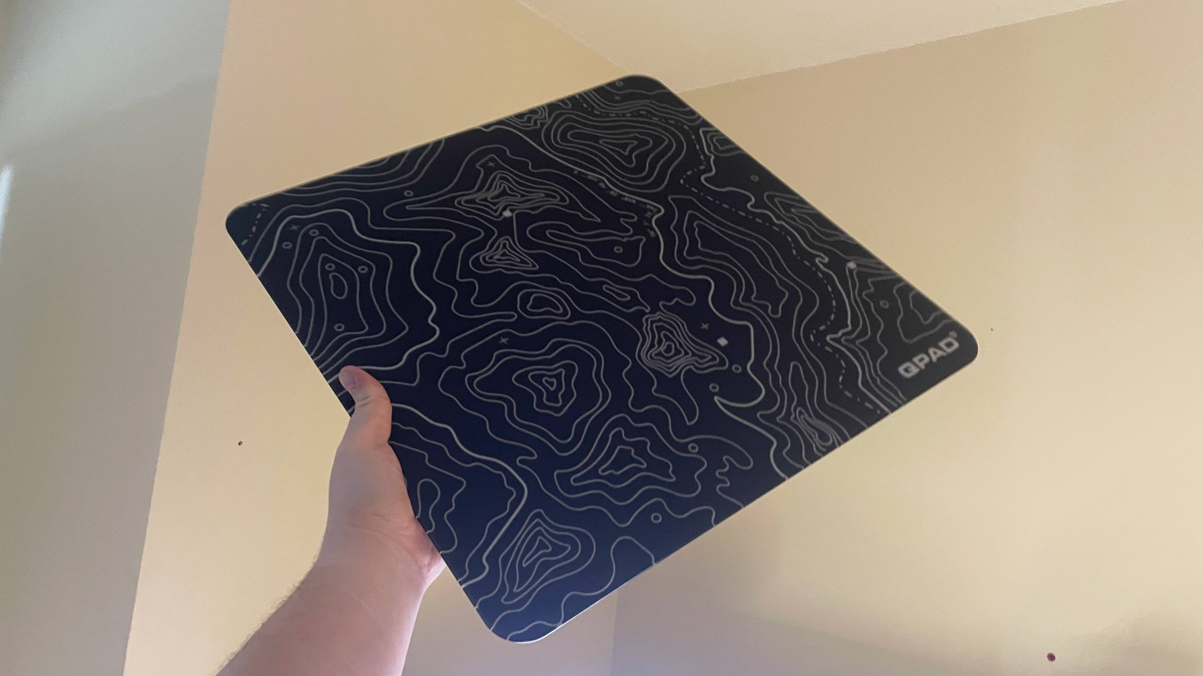 A QPAD Obsidian Glass mouse pad.