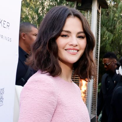 Selena Gomez attended a friend's wedding in a red turtleneck Cult Gaia dress