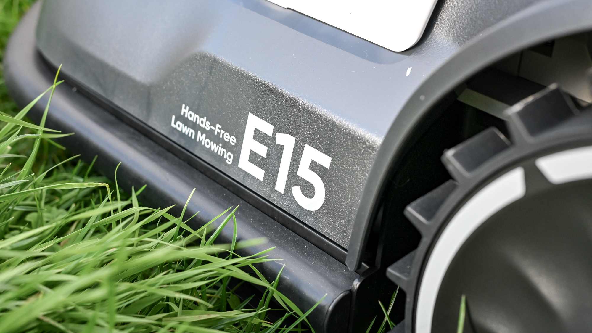 The Eufy E15 robot lawnmower logos along the side
