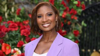 Denise Lewis in lilac suit