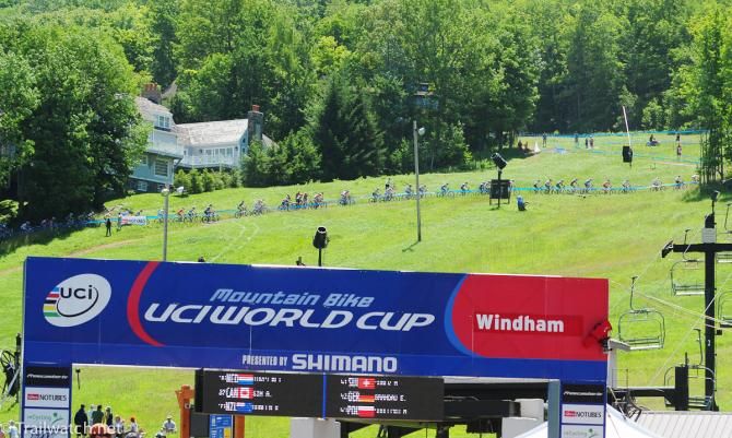 Racers climb a section of course named "Alp d&rsquo;Huez" to begin their trip up Windham Mountain