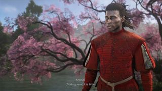 Assassin's Creed Shadows Immersive Mode: Diogo speaking Portuguese while standing in front of a Sakura tree. 