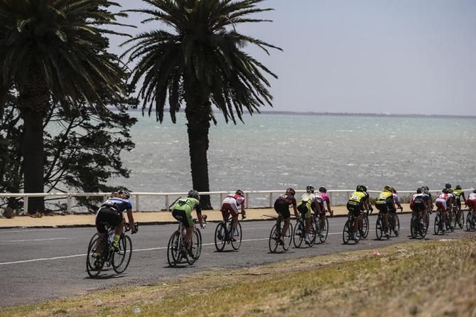 The womens field head into a strong head wind