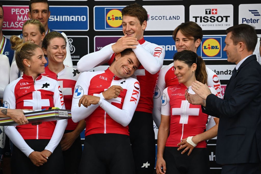 Riders from Switzerland celebrate with their gold medals and cow mascots after the Team Time Trial Mixed Relay road race during the UCI Cycling World Championships in Glasgow Scotland on August 8 2023 Switzerland won gold France won silver and Germany bronze Photo by Oli SCARFF AFP Photo by OLI SCARFFAFP via Getty Images