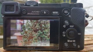 Photograph of Sony A6000 camera showing rear LCD screen