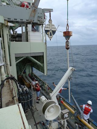 A sediment core comes aboard the R/V Knorr.