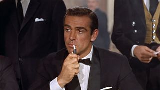 James Bond lights a cigarette in Dr. No
