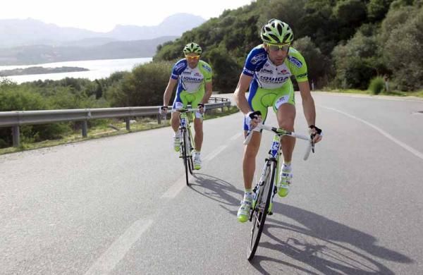 Vincenzo Nibali pushes away from Ivan Basso