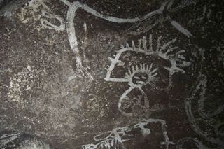 A depiction of a man rubbed into a Mona Island cave wall at least 500 years ago