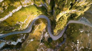 Drone shot of a road winding through a gorge