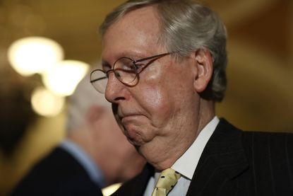 Mitch McConnell takes questions from reporters in Washington