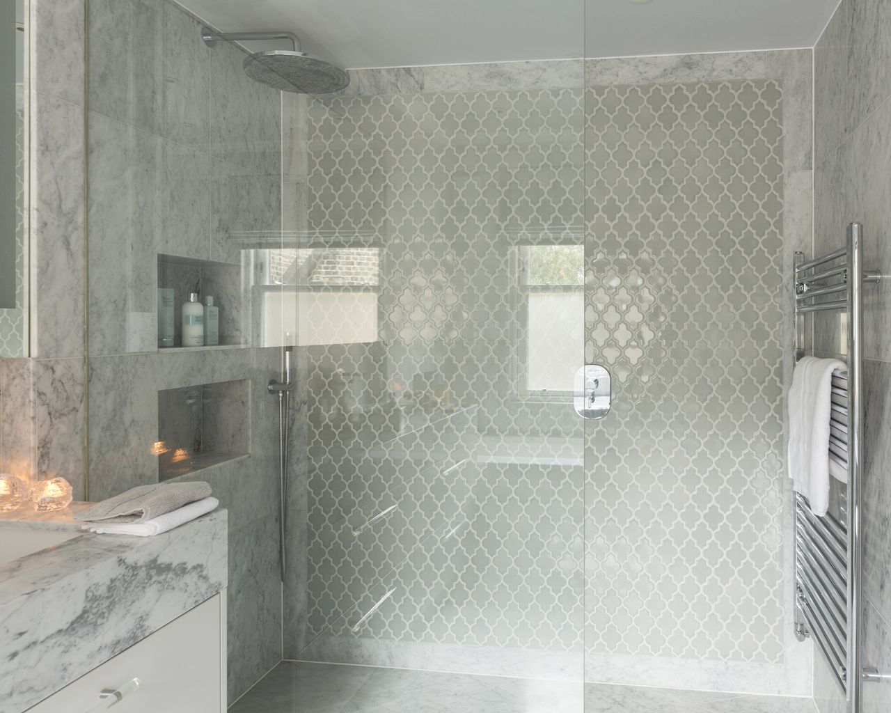 Walk-in shower with both large marble slabs and mosaic-tiled - shower tile ideas