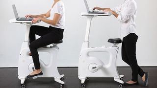 A woman using the Deskcise Pro for sitting and standing