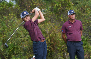 Carson Kuchar hits a drive in front of his dad