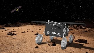 a four-wheeled black cartoon rover stands on the surface of a planet hued in light browns. A starry night space scape is seen above with a satellite in the upper left.