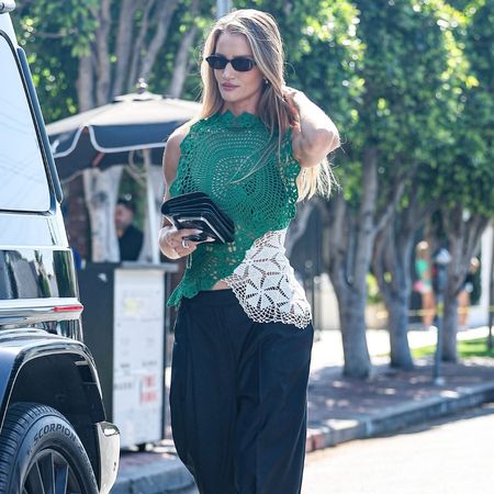 RHW wears a crochet top.