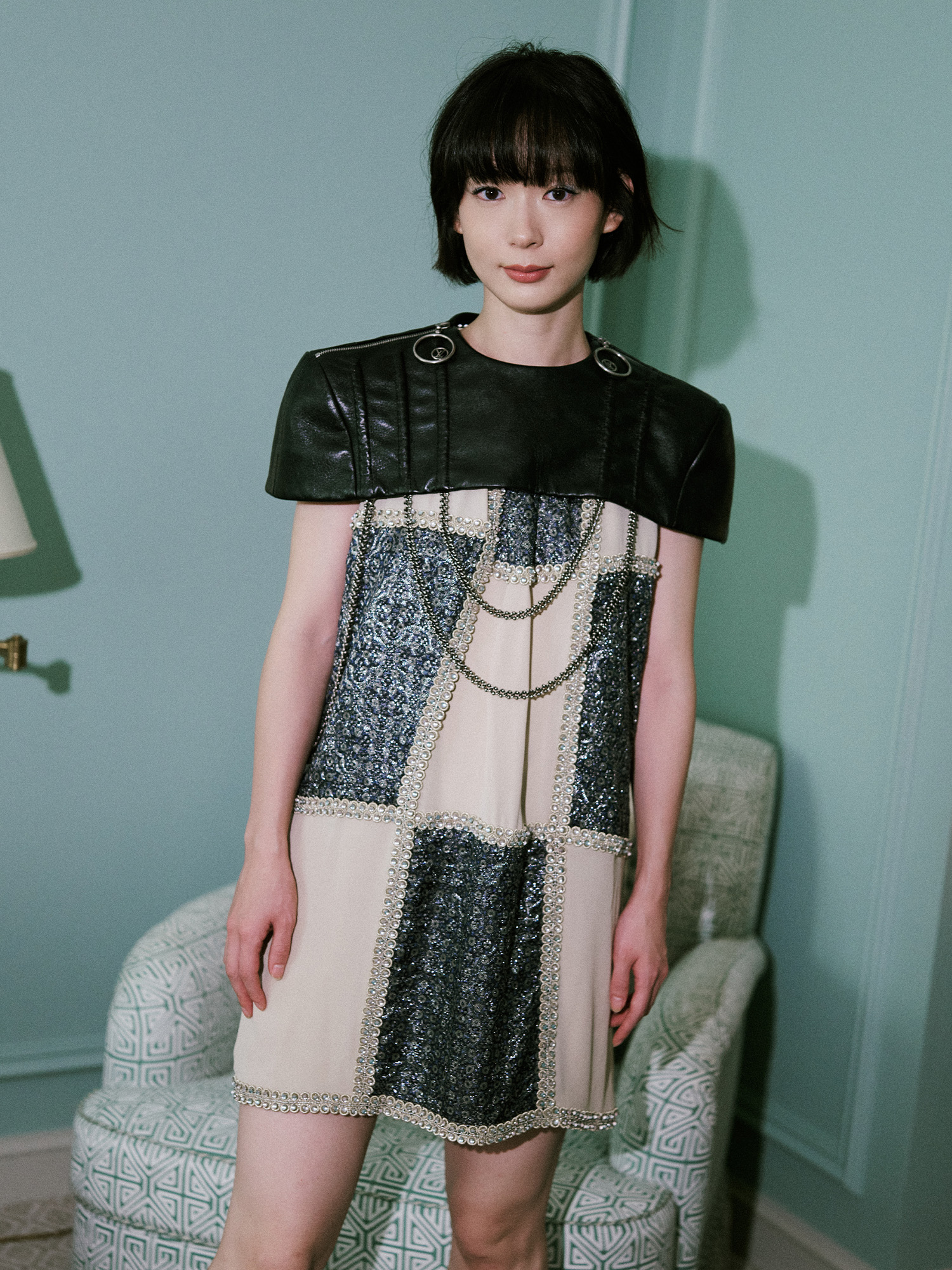 Moeka Hoshi Paris Fashion Week photo diary for the Louis Vuitton Spring 2026 show. Moeka poses for a portrait in her Louis Vuitton dress and leather capelet.