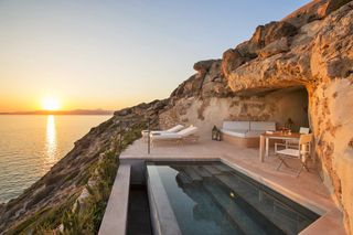 Beautiful hotel built into rock face with view over sea