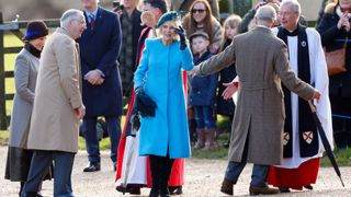 Queen Camilla wearing a bright blue outfit