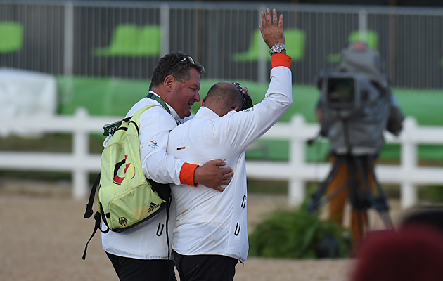 Groom Robbie Sanderson leaving the team dressage medal ceremony