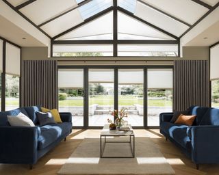Blue sofas in conservatory idea by Thomas Sanderson