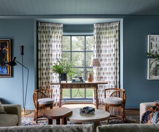 family room blue walls sheer print curtains