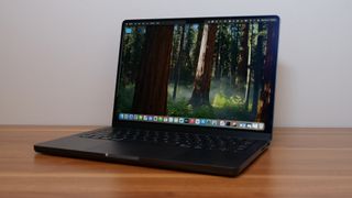 Apple MacBook Pro 14-inch M4 2024 on a wooden desk