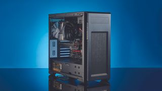Mid-tower gaming PC on blue background