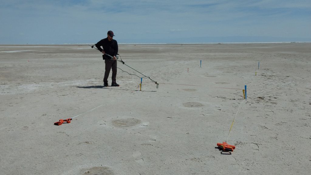 The round impressions on the ground in this photograph show mammoth footprints. The mammoth crossed the human&rsquo;s path after the human passed on his or her northbound journey. Hours later, the human stepped in the mammoth footprints on the southbound trip back.
